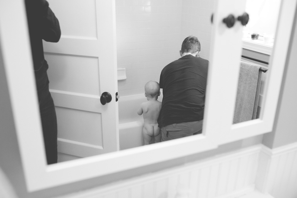 documentary family photography - getting ready for a bath baby