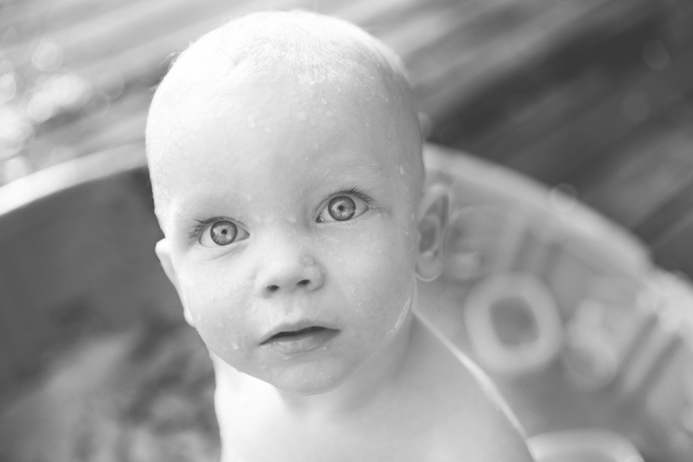 documentary family photography - baby with wet face