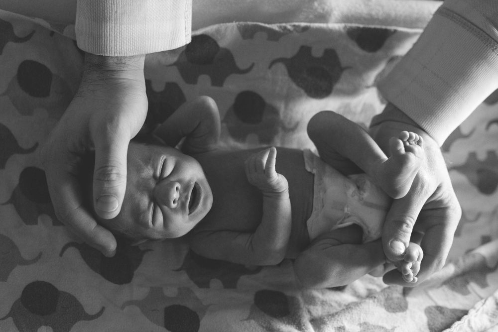 documentary newborn photography Portland Oregon baby in dads hands